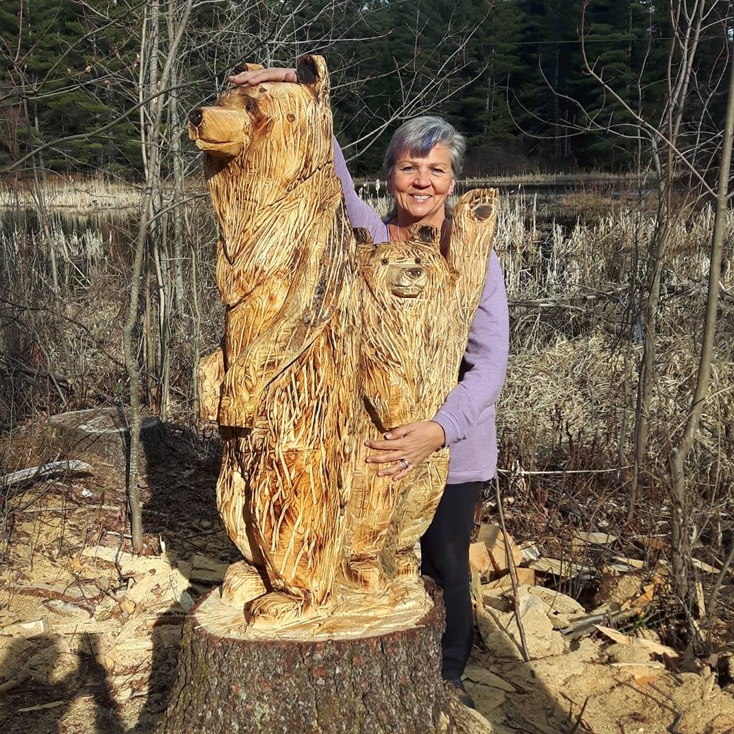 Having recently taken up chainsaw carving, these guys, carved from a double stump white pine trunk, now welcome visitors to my home